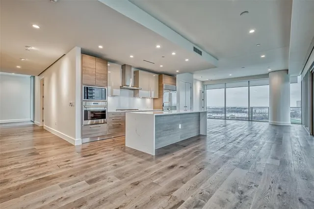 a view of kitchen with cabinets and wooden floor