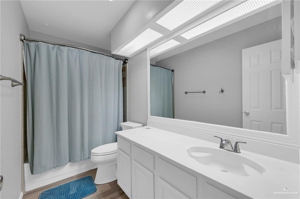 1409 Heritage Oaks Road Edinburg, TX 78539 - Photo 9 of 18 a bathroom with a sink a toilet and shower