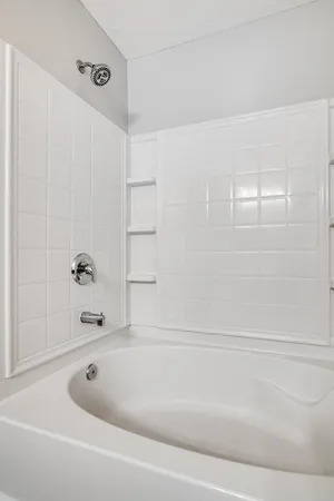 a view of an empty room and a window