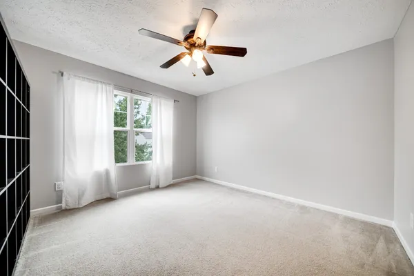 a view of house with backyard