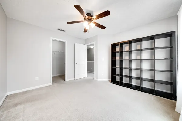 a view of a swimming pool with a yard