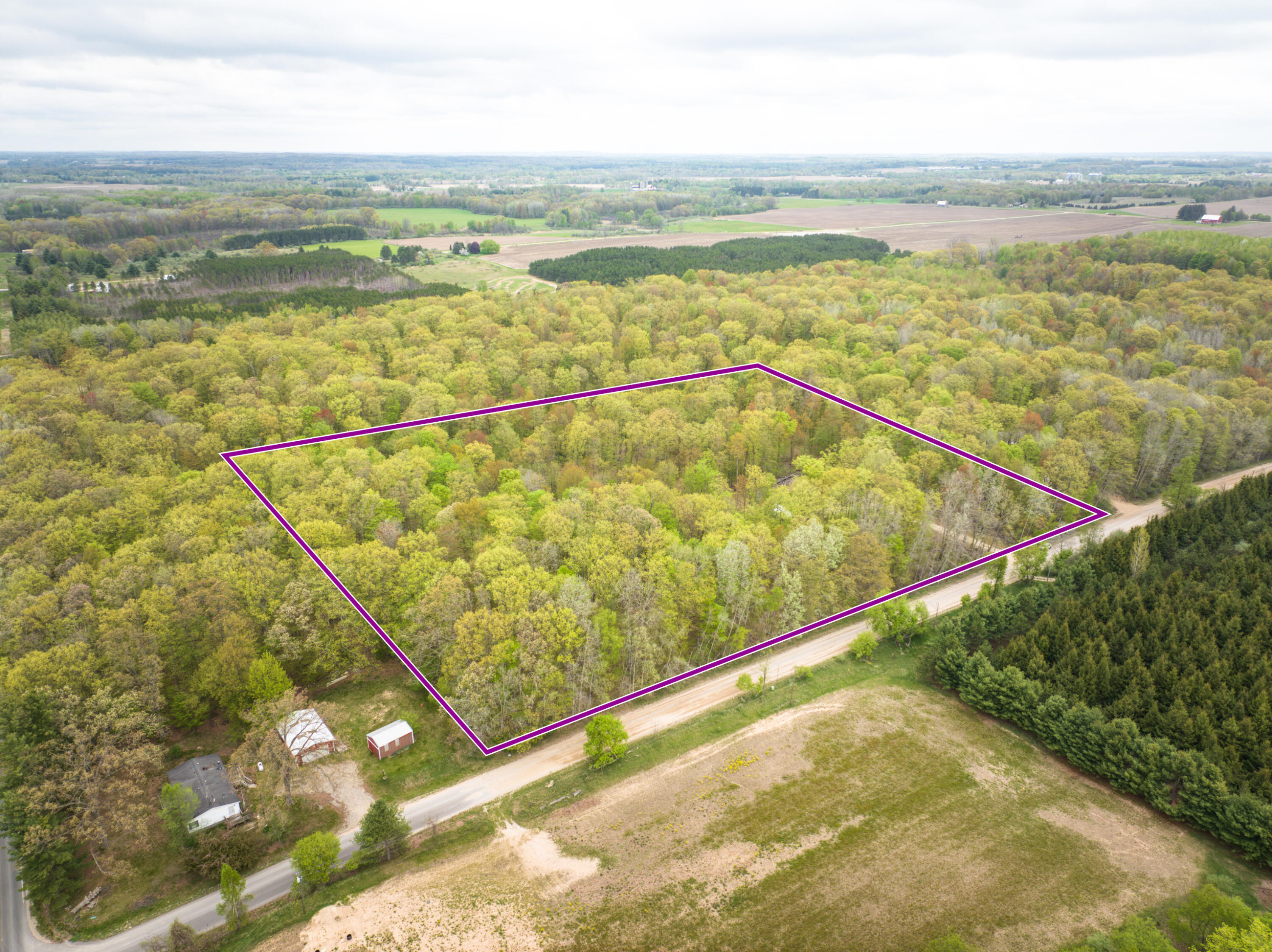 4848 Cutler Road Six Lakes, MI 48886 - Photo 1 of 23 DJI_20250427171049_0029_D_58