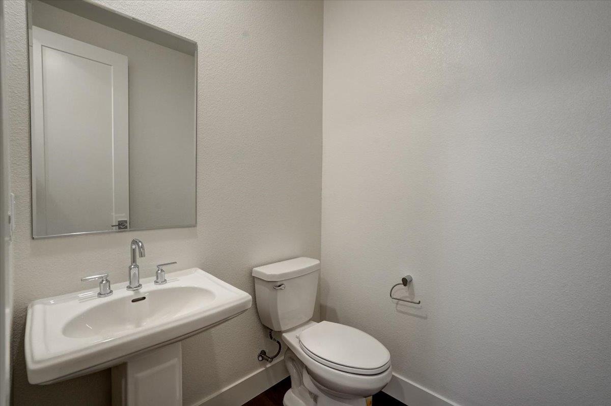 12101 Almeria Way San Ramon, CA 94583 - Photo 15 of 44 a bathroom with a sink toilet and a mirror