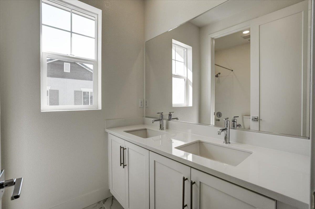 12101 Almeria Way San Ramon, CA 94583 - Photo 23 of 44 a bathroom with a sink a vanity and a mirror