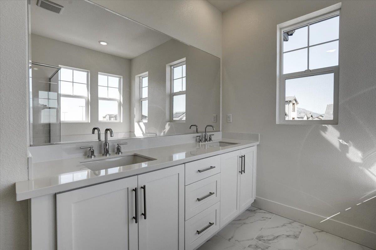 12101 Almeria Way San Ramon, CA 94583 - Photo 29 of 44 a bathroom with double sink and a window