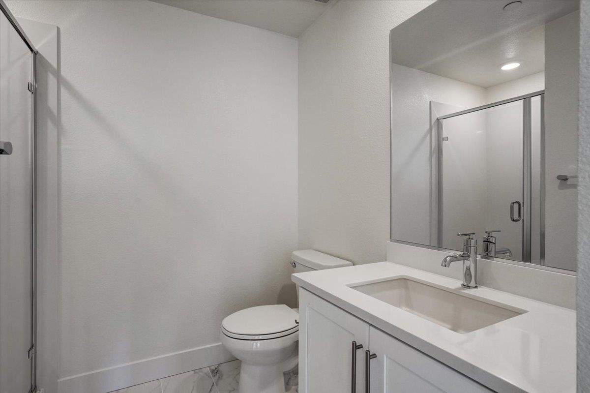 12101 Almeria Way San Ramon, CA 94583 - Photo 34 of 44 a bathroom with a sink and a toilet