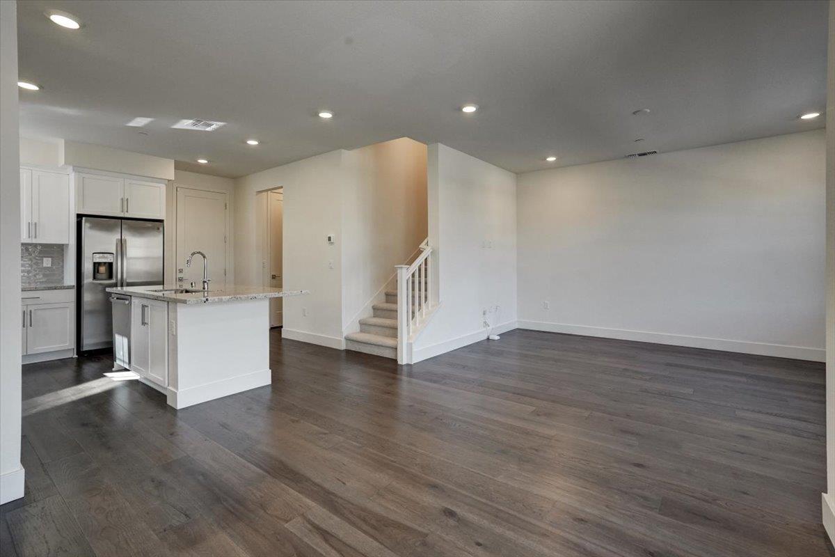 12101 Almeria Way San Ramon, CA 94583 - Photo 8 of 44 a view of kitchen with refrigerator and wooden floor