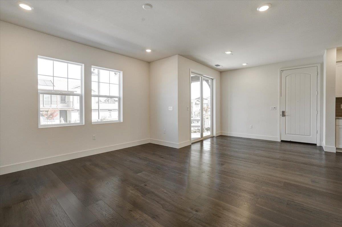 12101 Almeria Way San Ramon, CA 94583 - Photo 9 of 44 a view of an empty room with wooden floor and window