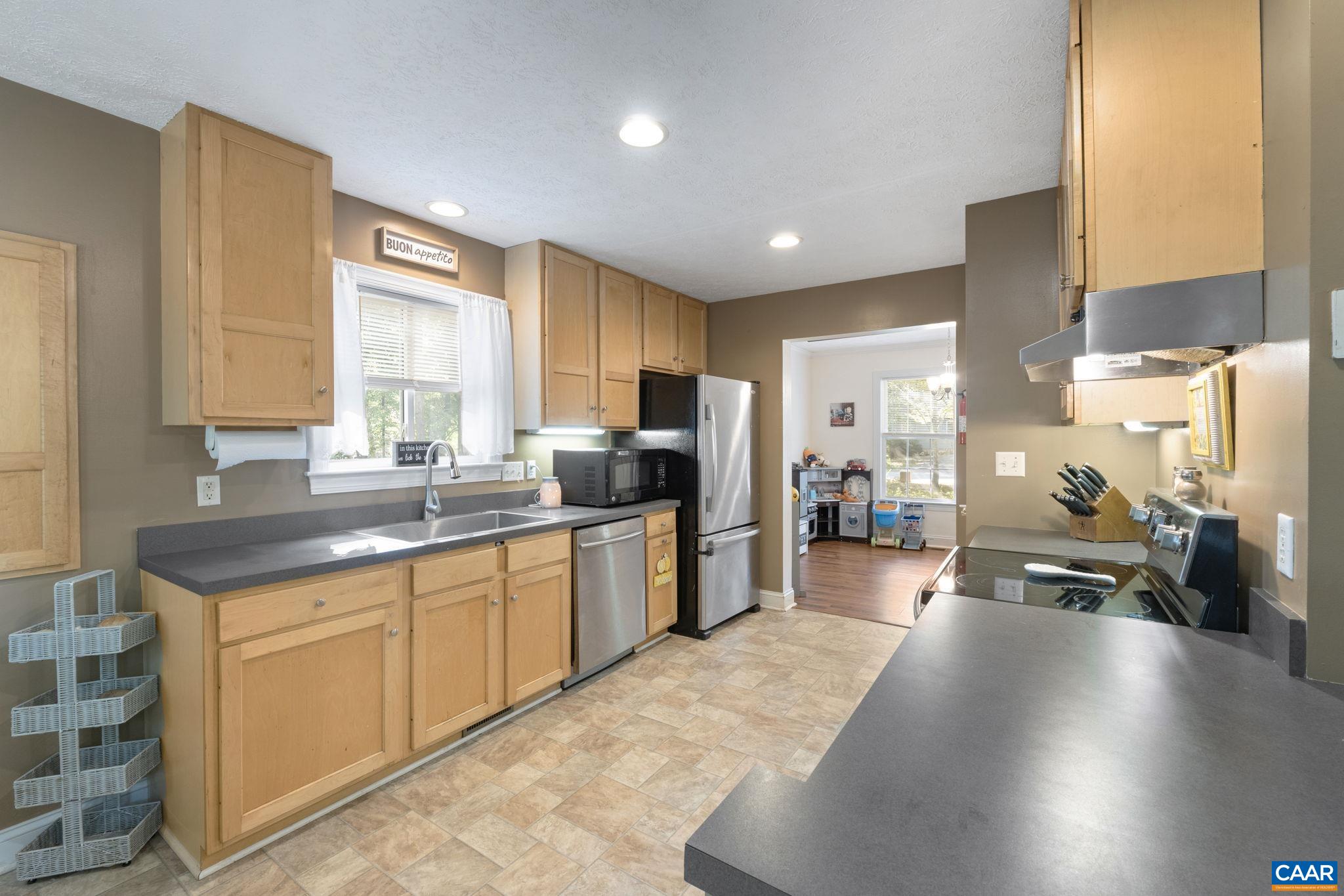 4 Clark Court Palmyra, VA 22963 - Photo 13 of 58 a kitchen with stainless steel appliances granite countertop a refrigerator sink and cabinets