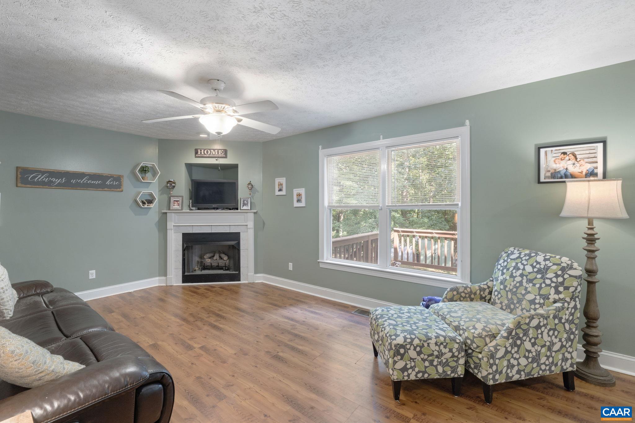 4 Clark Court Palmyra, VA 22963 - Photo 17 of 58 a living room with furniture and a fireplace