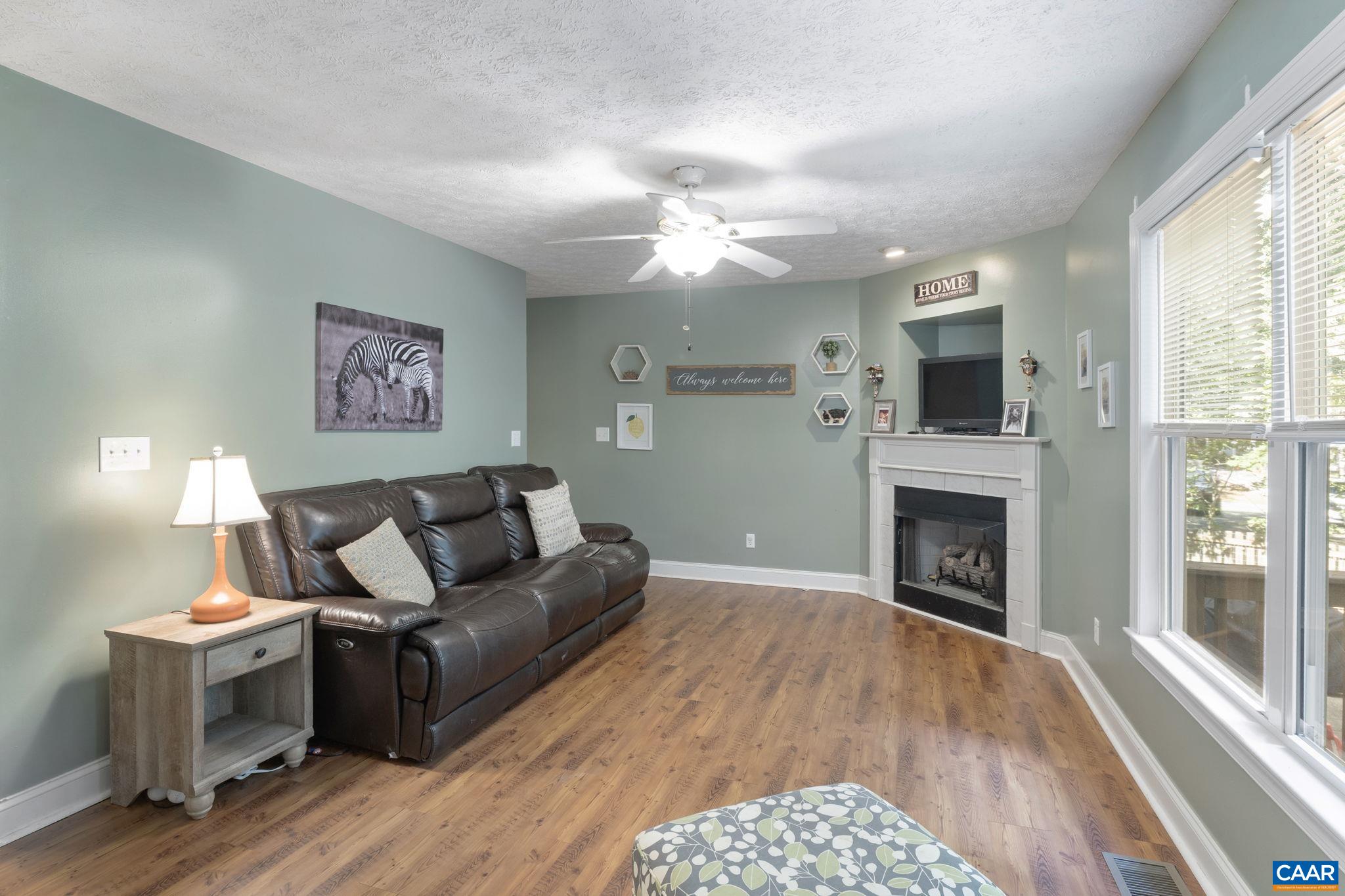 4 Clark Court Palmyra, VA 22963 - Photo 20 of 58 a living room with furniture and a fireplace