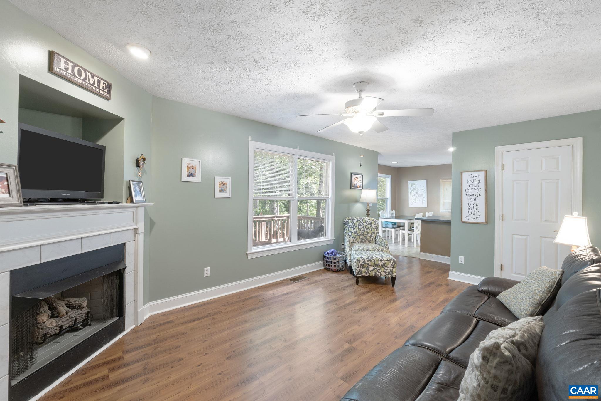 4 Clark Court Palmyra, VA 22963 - Photo 21 of 58 a living room with furniture and a fireplace
