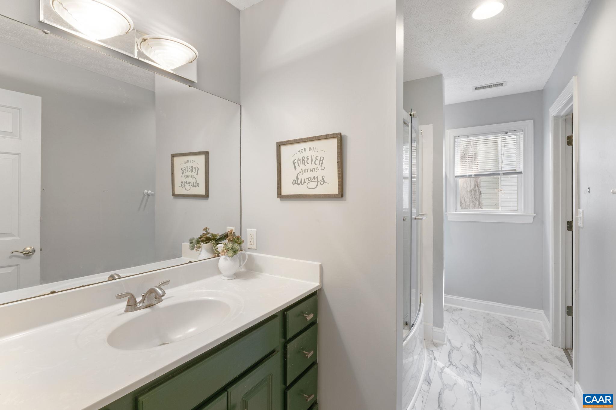 4 Clark Court Palmyra, VA 22963 - Photo 29 of 58 a bathroom with a sink and a mirror