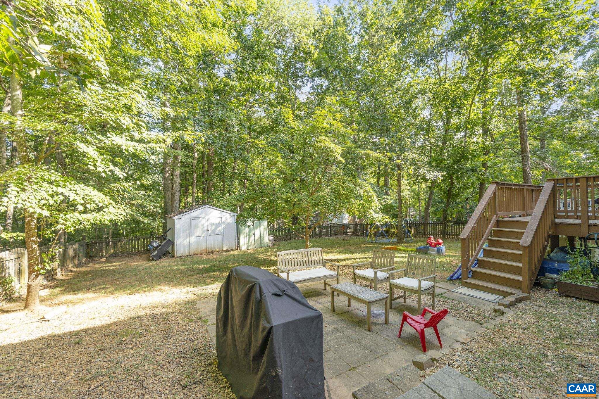 4 Clark Court Palmyra, VA 22963 - Photo 34 of 58 a view of a patio with lawn chairs wooden floor and fence