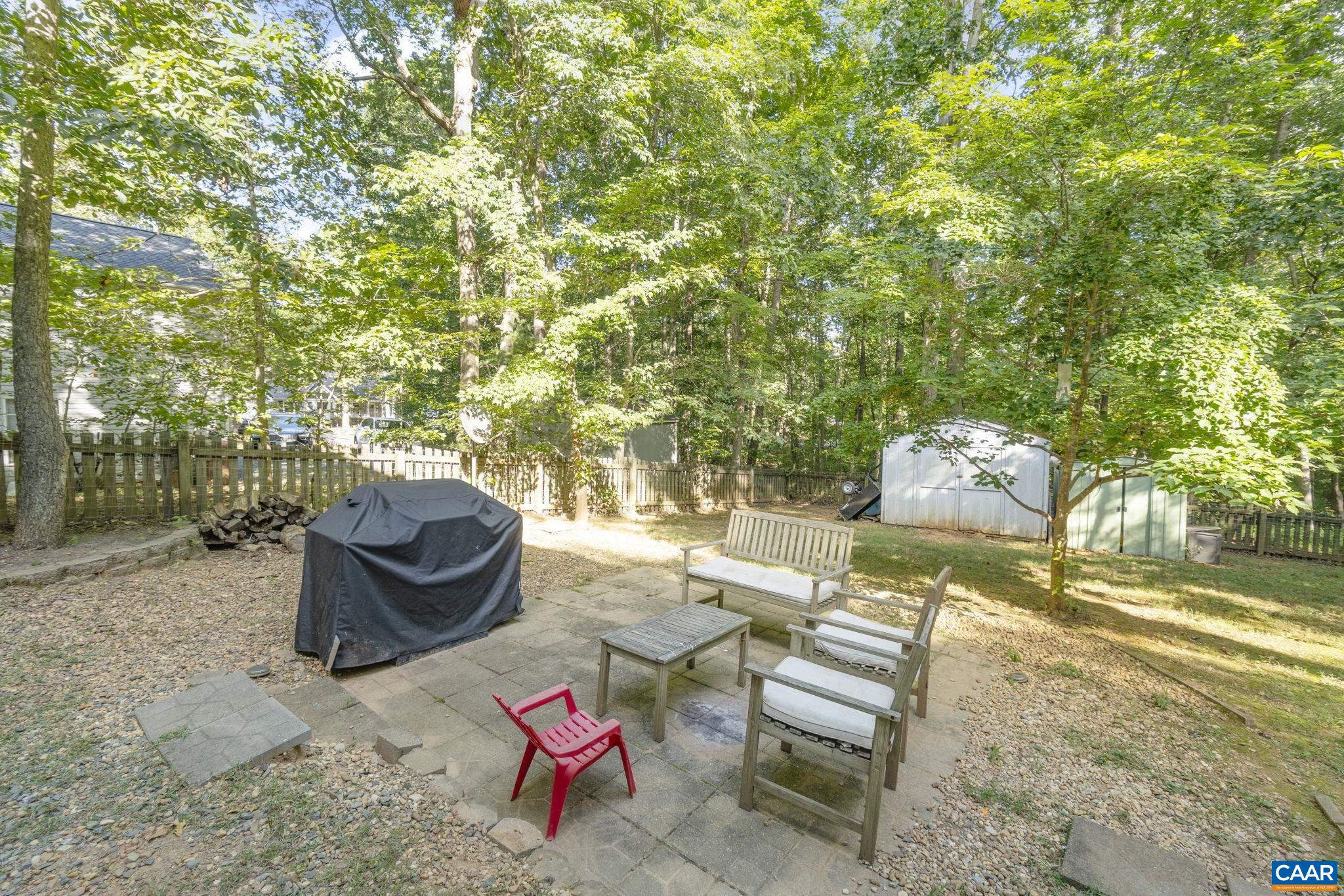 4 Clark Court Palmyra, VA 22963 - Photo 35 of 58 a backyard of a house with table and chairs