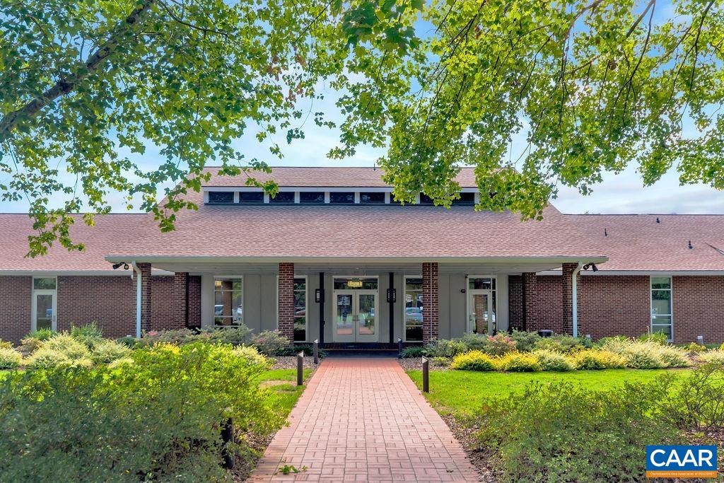 4 Clark Court Palmyra, VA 22963 - Photo 54 of 58 front view of a brick house with a yard table and chairs