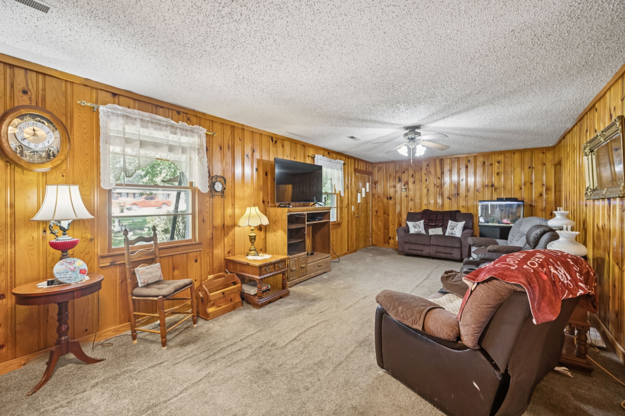 5165 Almaville Road Smyrna, TN 37167 - Photo 18 of 37 a living room with furniture a flat screen tv and a large window