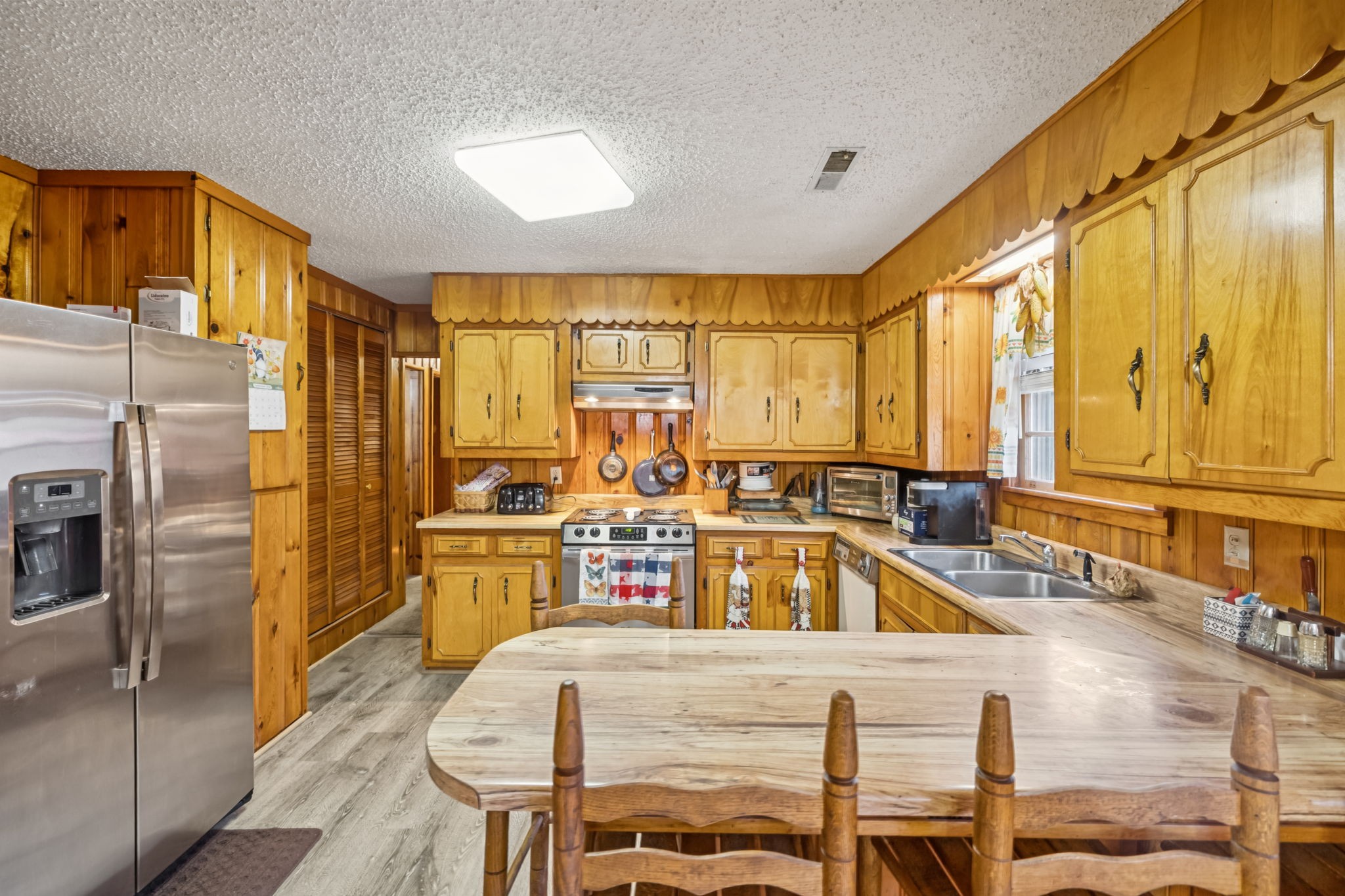 5165 Almaville Road Smyrna, TN 37167 - Photo 21 of 37 a kitchen with stainless steel appliances granite countertop a sink and a refrigerator