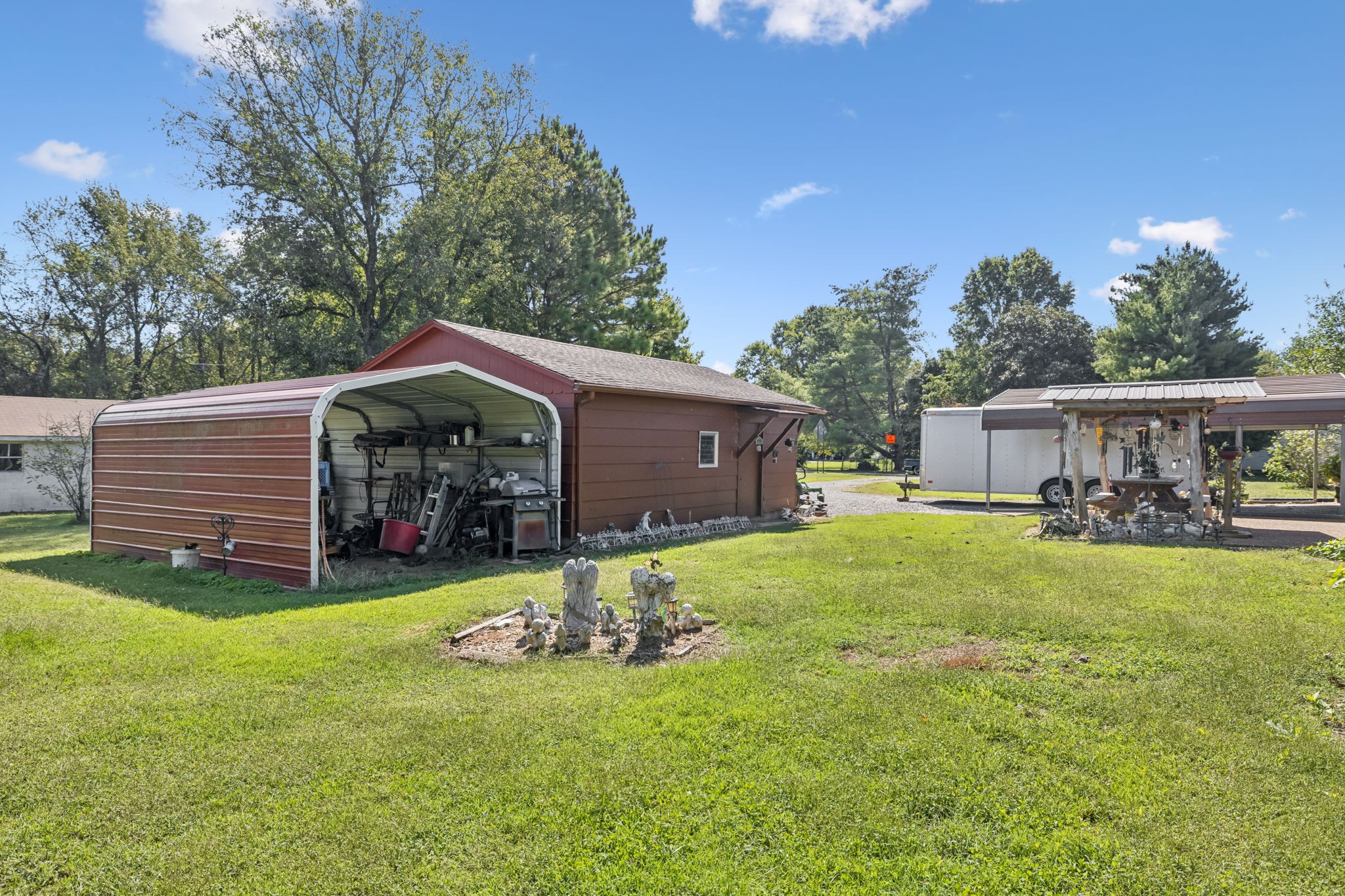 5165 Almaville Road Smyrna, TN 37167 - Photo 34 of 37 a view of a house with a yard and garage