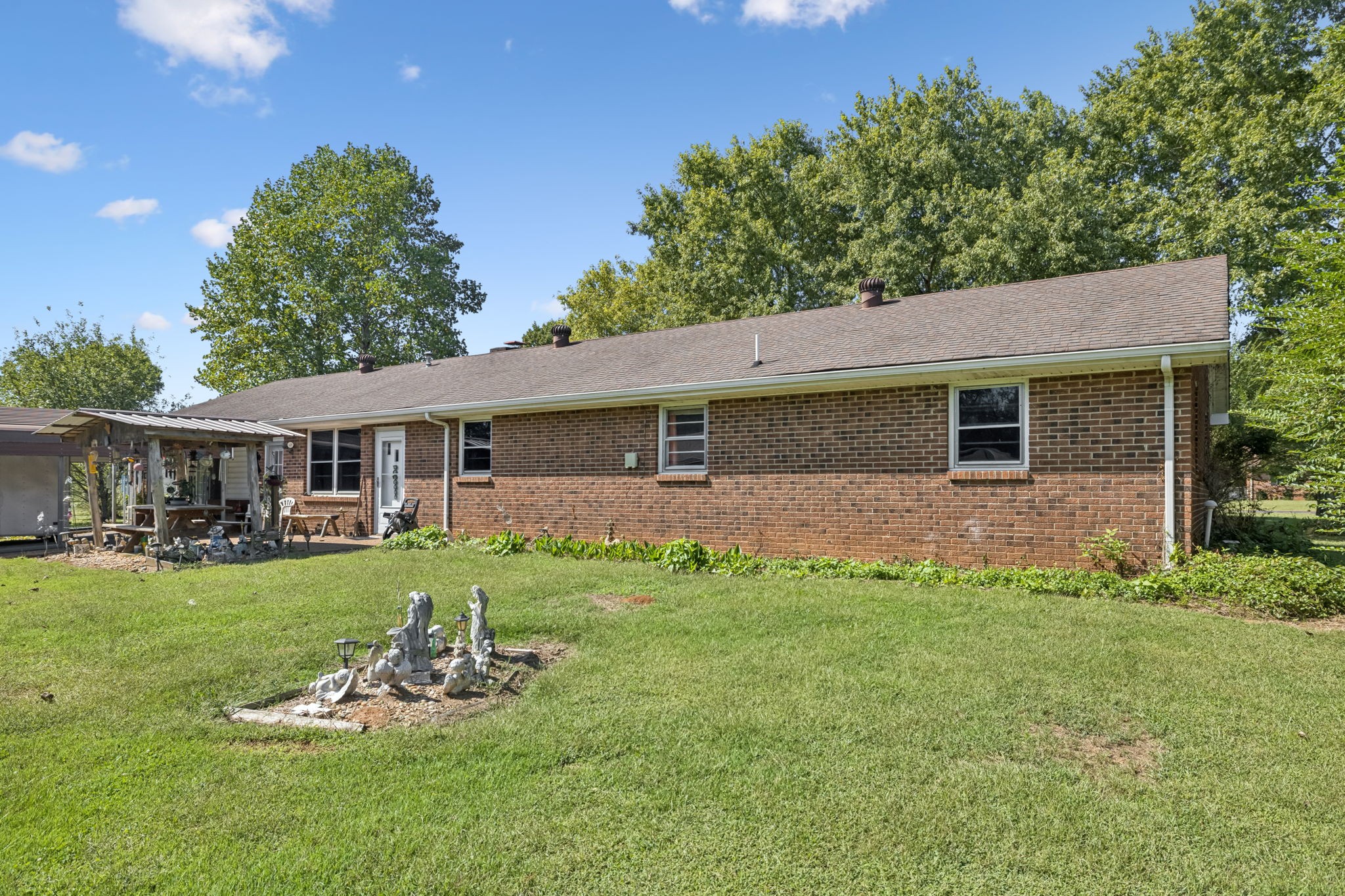 5165 Almaville Road Smyrna, TN 37167 - Photo 36 of 37 a front view of house with a garden and patio