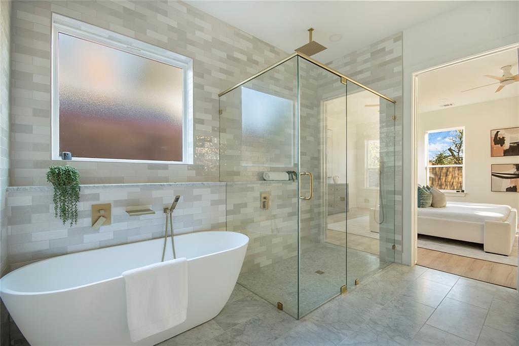 3902 Furey Street Dallas, TX 75212 - Photo 14 of 34 Ensuite bathroom with a freestanding bath, a shower stall, and tile walls