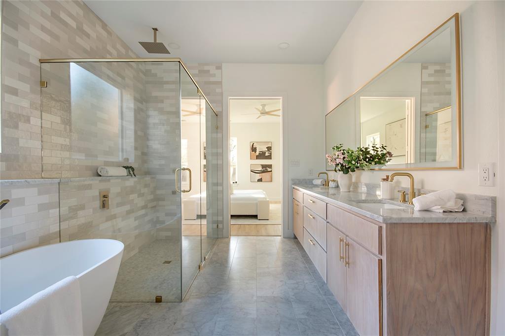 3902 Furey Street Dallas, TX 75212 - Photo 15 of 34 Bathroom featuring ensuite bathroom, double vanity, a soaking tub, a stall shower, and a ceiling fan