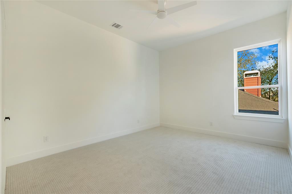 3902 Furey Street Dallas, TX 75212 - Photo 19 of 34 Carpeted empty room with baseboards and a ceiling fan