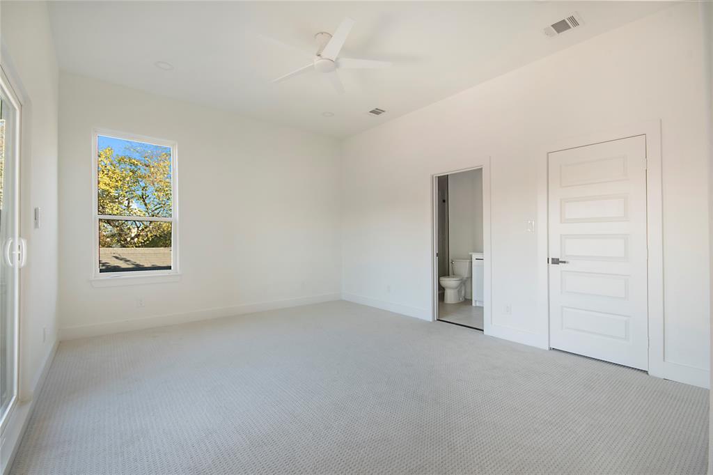3902 Furey Street Dallas, TX 75212 - Photo 27 of 34 Unfurnished bedroom featuring carpet, ensuite bath, and a ceiling fan