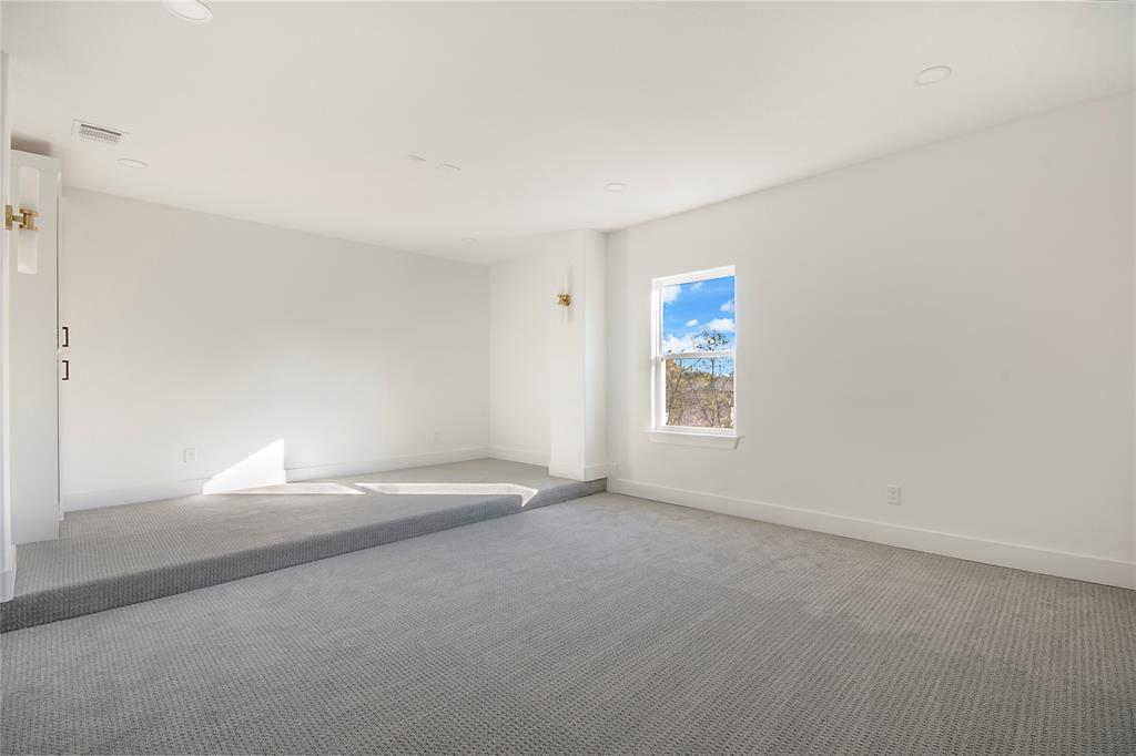 3902 Furey Street Dallas, TX 75212 - Photo 29 of 34 Spare room featuring baseboards and carpet