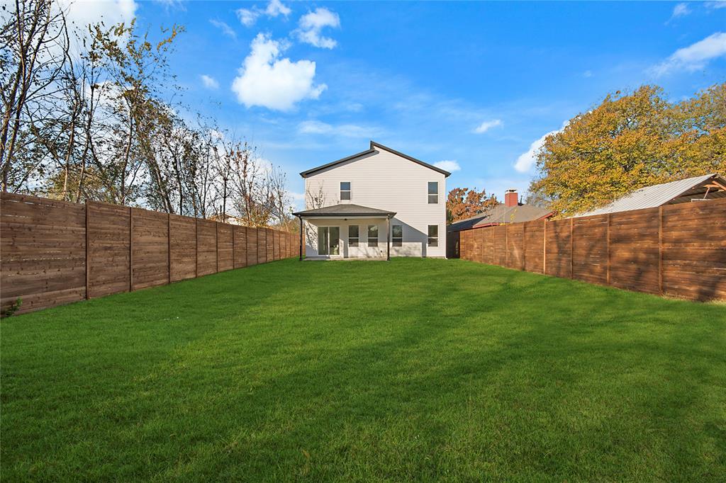3902 Furey Street Dallas, TX 75212 - Photo 32 of 34 Rear view of property with a patio area and a fenced backyard