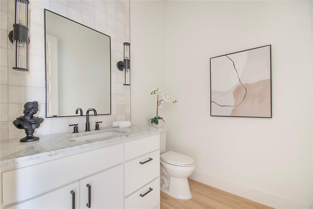 3902 Furey Street Dallas, TX 75212 - Photo 5 of 34 Half bath with vanity and light wood-style floors