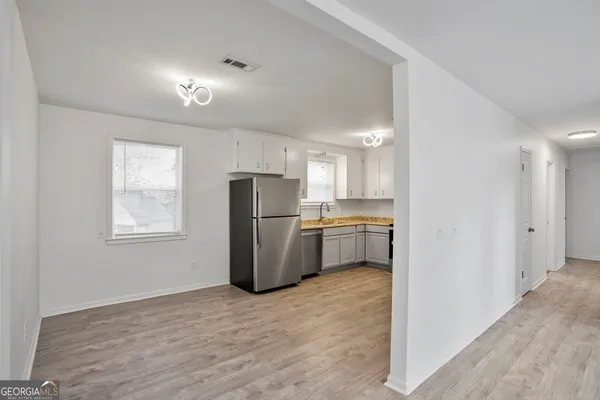 a kitchen with a refrigerator a sink and dishwasher