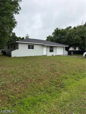 a house with trees in the background