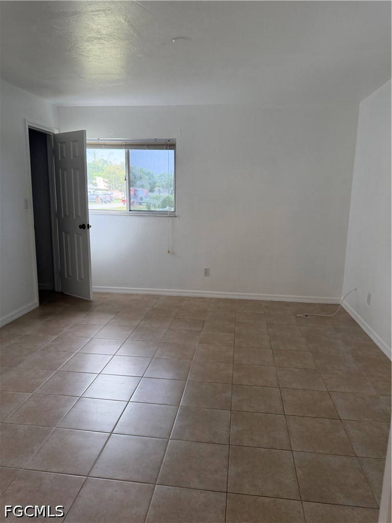 2610 W Road Fort Myers, FL 33905 - Photo 12 of 23 a view of an empty room with a window