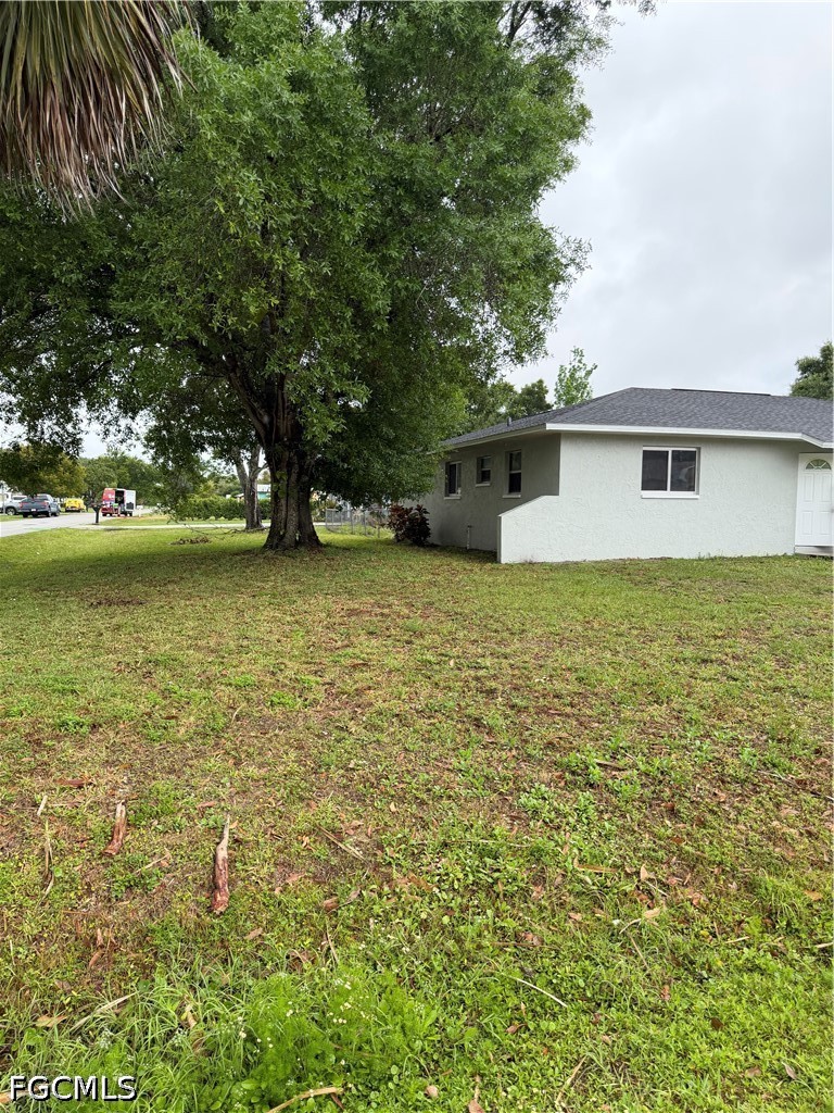 2610 W Road Fort Myers, FL 33905 - Photo 2 of 23 a view of a house with a yard
