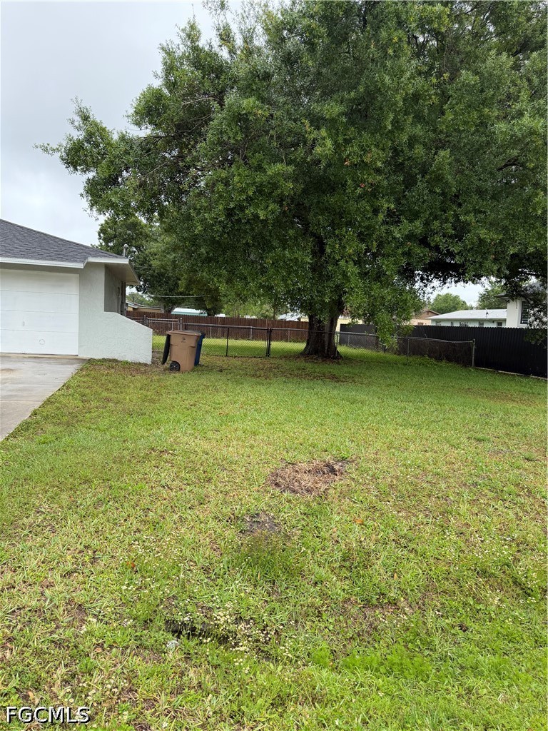 2610 W Road Fort Myers, FL 33905 - Photo 3 of 23 a view of a garden with a bench
