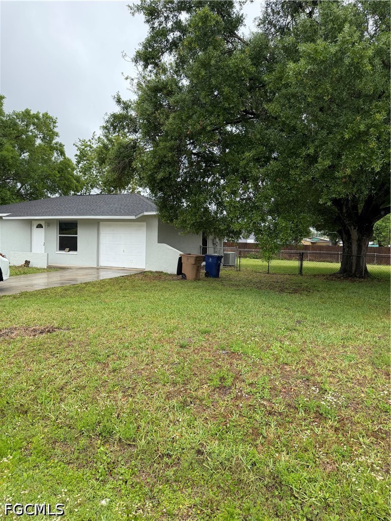 2610 W Road Fort Myers, FL 33905 - Photo 4 of 23 a view of a house with a yard