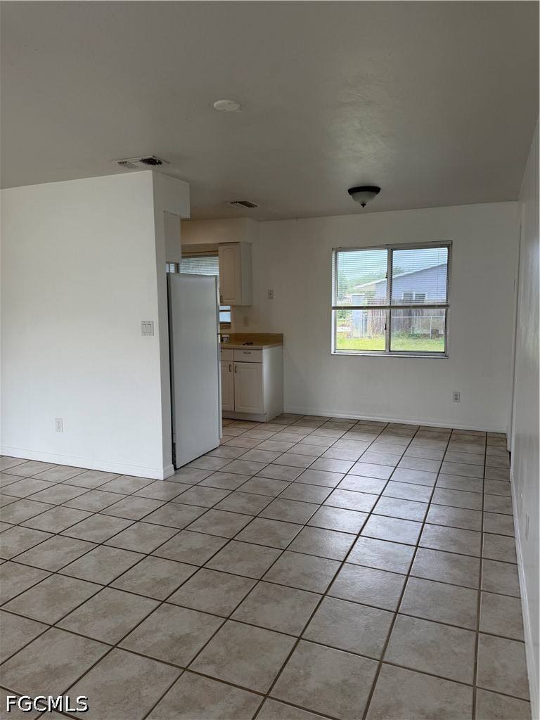 2610 W Road Fort Myers, FL 33905 - Photo 7 of 23 a view of a kitchen with a dishwasher and a refrigerator
