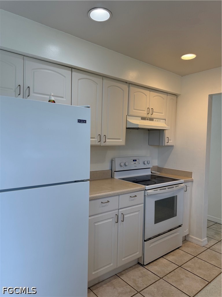 2610 W Road Fort Myers, FL 33905 - Photo 9 of 23 a kitchen with stainless steel appliances granite countertop a refrigerator a stove a sink and white cabinets