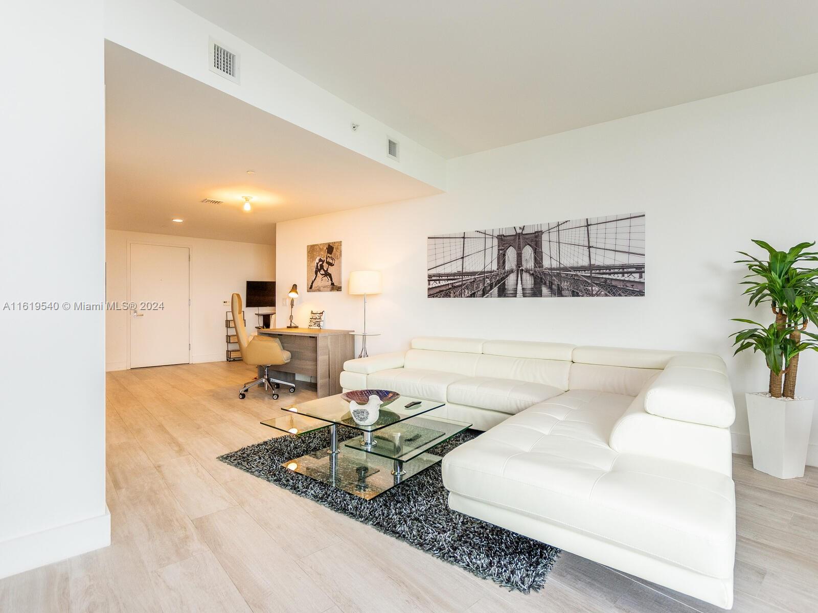 a living room with furniture and a table