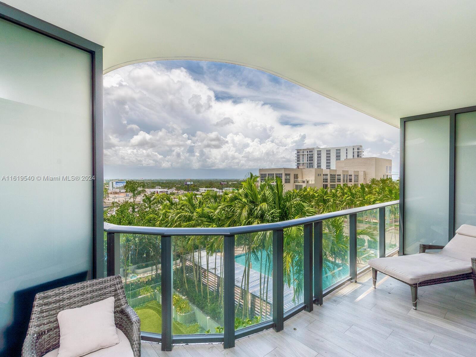 121 Northeast 34th Street, Unit 1014 Miami, FL 33137 - Photo 19 of 30 a view of a balcony with furniture