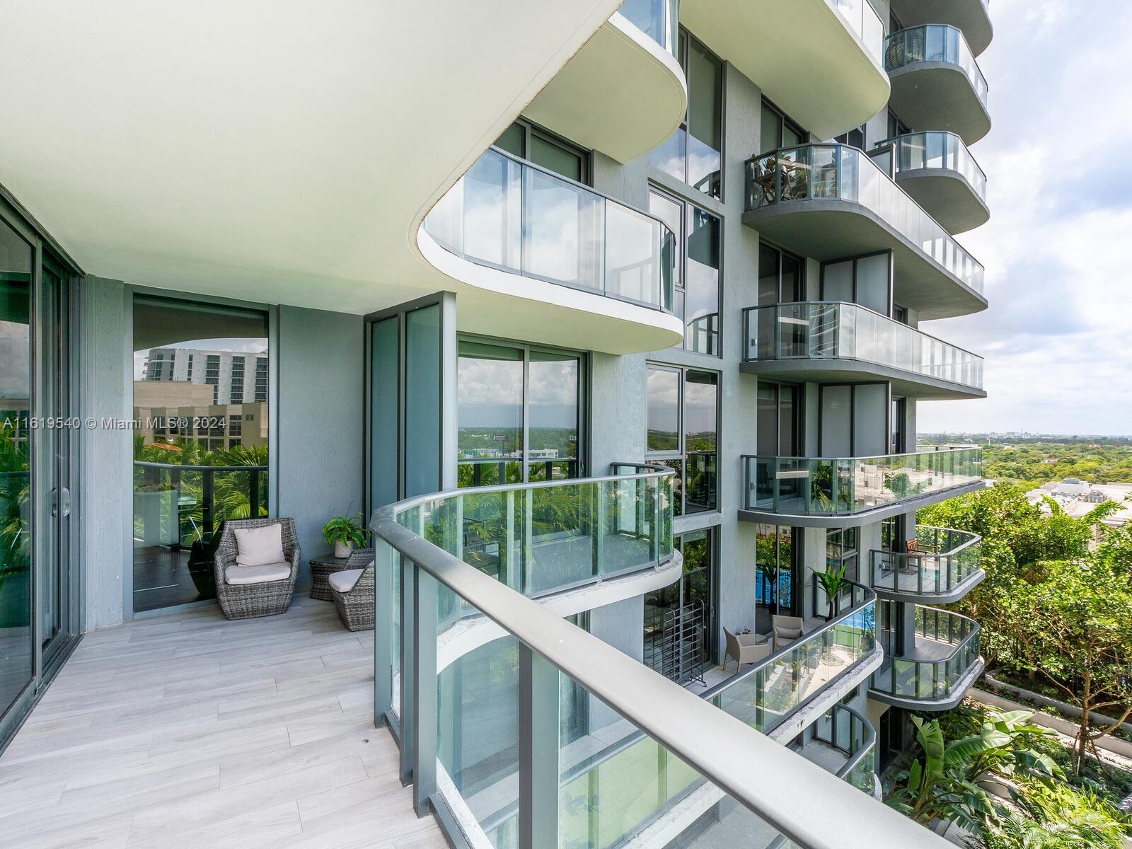 121 Northeast 34th Street, Unit 1014 Miami, FL 33137 - Photo 30 of 30 a view of a chairs and table in a patio