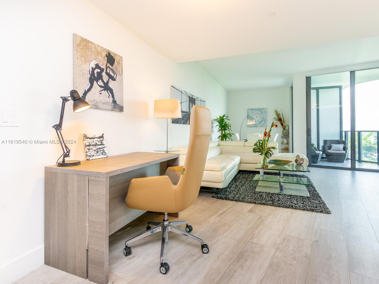 121 Northeast 34th Street, Unit 1014 Miami, FL 33137 - Photo 3 of 30 a living room with furniture and a rug