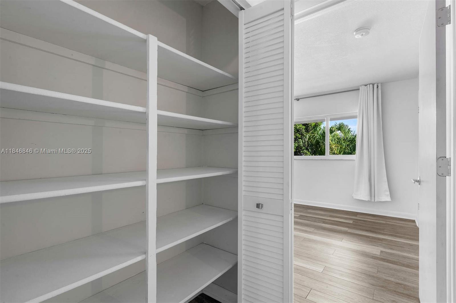 8218 Southwest 82nd Court Miami, FL 33143 - Photo 11 of 20 a view of a hallway with closet