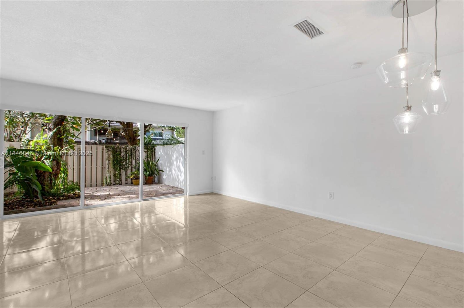 8218 Southwest 82nd Court Miami, FL 33143 - Photo 3 of 20 a view of an empty room with a window