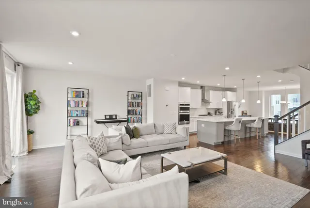 a bedroom with a large bed and a large window