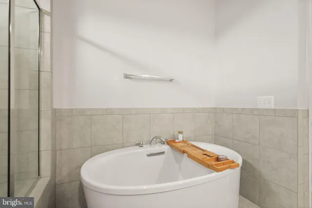 a picture of a bathroom with a shower