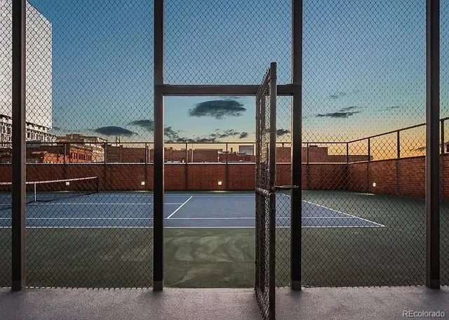 a balcony with view of residential buildings