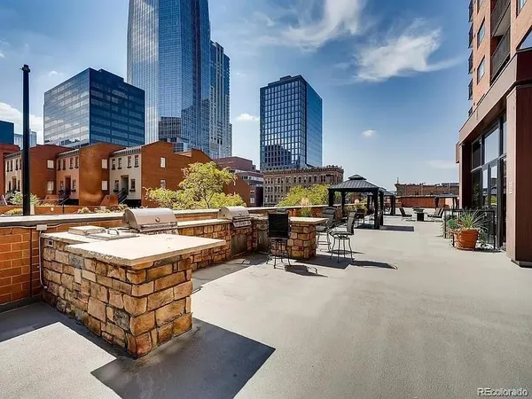 a view of a patio with swimming pool table and chairs