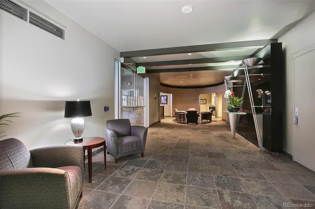 a view of livingroom with furniture and a window